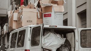 Van loaded with boxes in a narrow alleyway