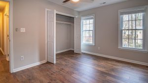 Empty bedroom with an open wardrobe