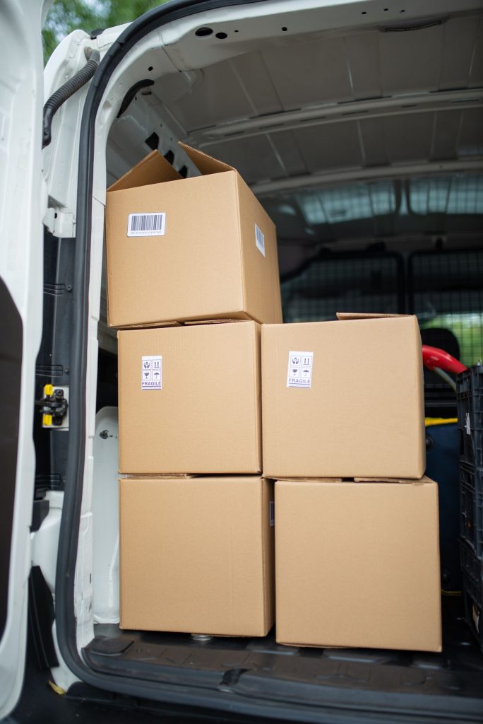 Boxes stacked and secured inside a loaded removal van